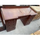 A VICTORIAN MAHOGANY BREAKFRONT TWIN-PEDESTAL DESK ENCLOSING NINE DRAWERS, 48" WIDE