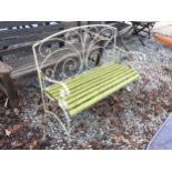 A METAL TWO SEATER GARDEN BENCH WITH WOODEN SLATS