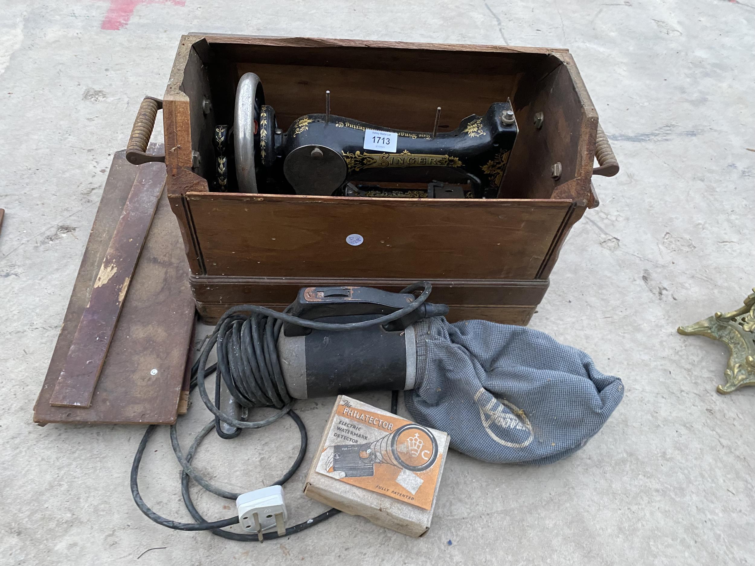 A VINTAGE SINGER SEWING MACHINE WITH WOODEN CARRY CASE AND A HOOVER HAND VACUUM