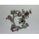 A SILVER CHARM BRACELET AND 15 APROX ASSORTED SILVER CHARMS