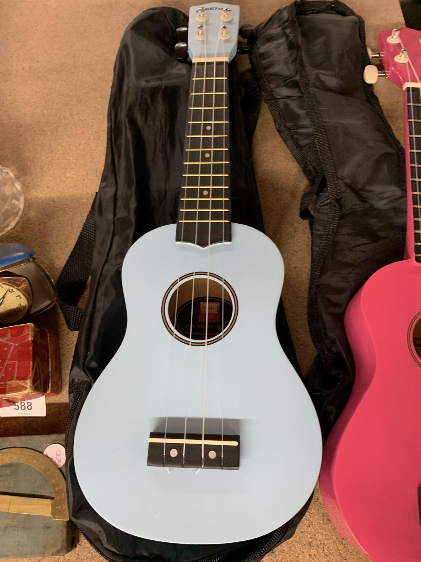 A PINK AND A BLUE CHILD'S UKELELE IN BAGS - Image 2 of 3