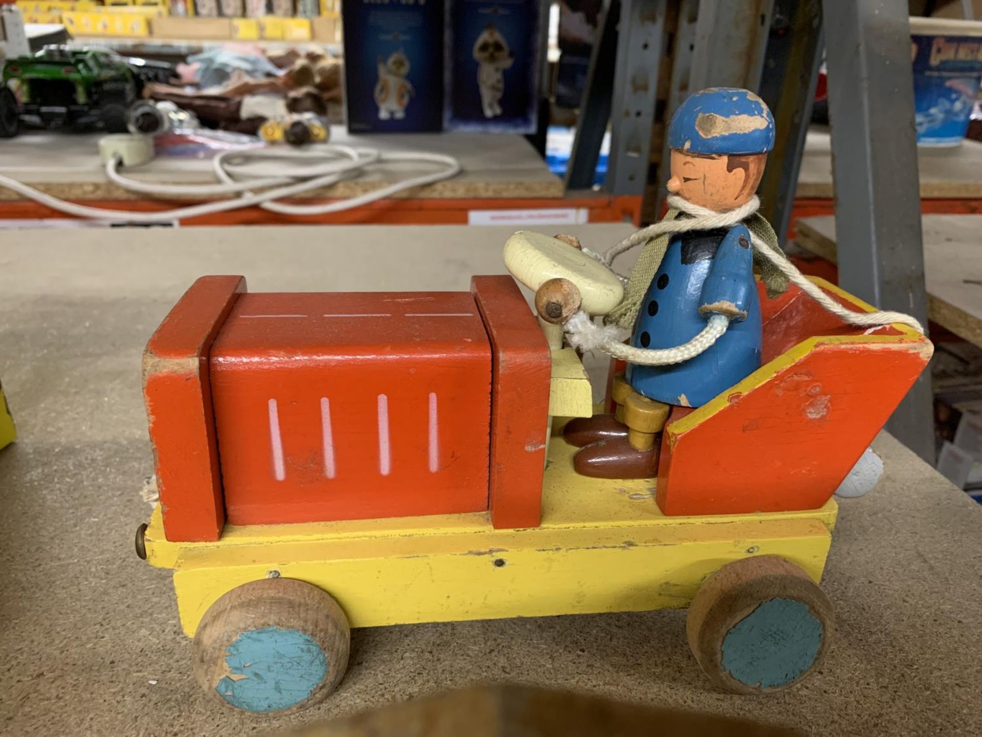 A VINTAGE WOODEN TRAIN AND A PAINTED MOTORCAR WITH DRIVER - Bild 2 aus 2