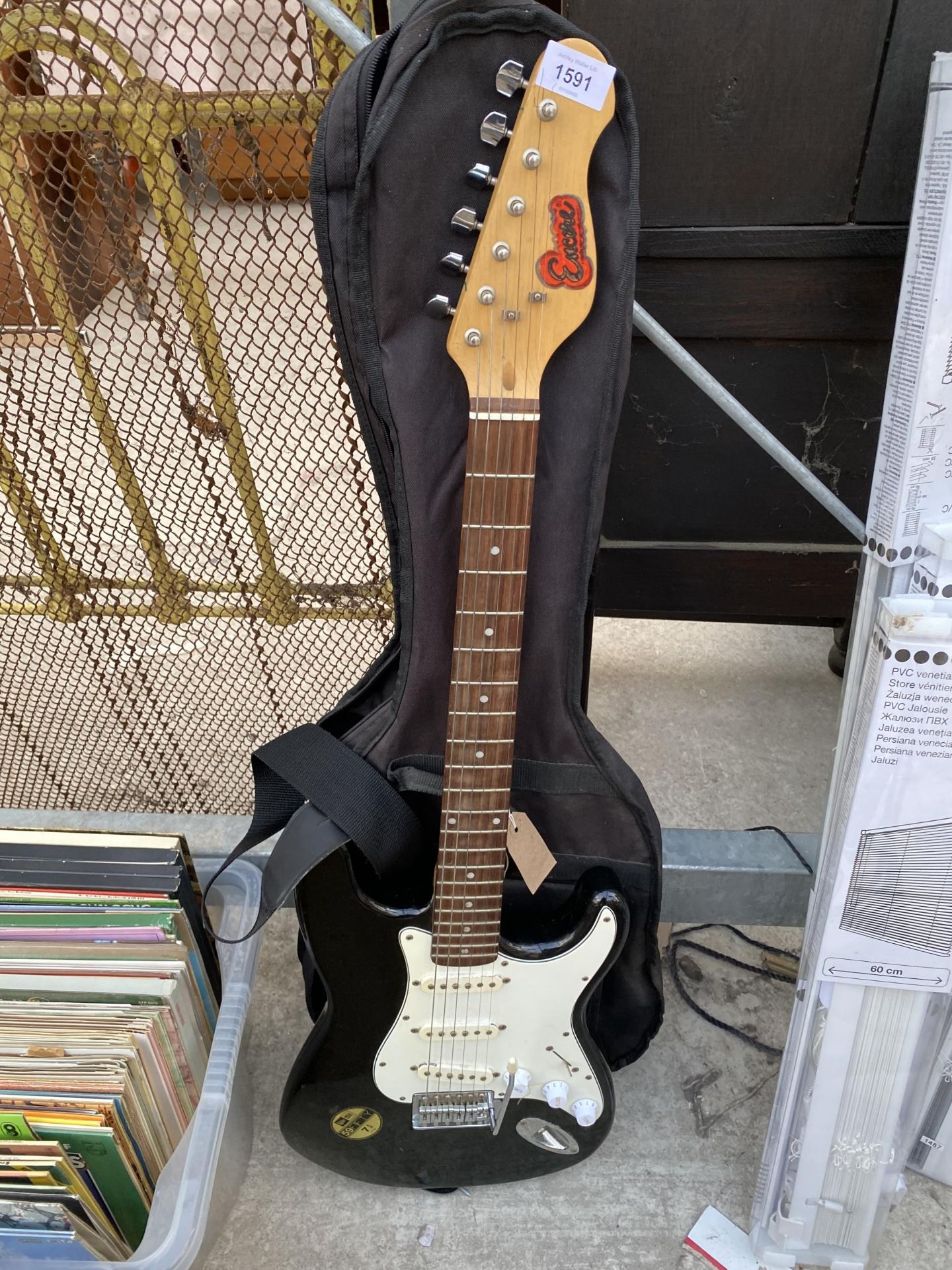 AN ENCORE ELECTRIC GUITAR AND CARRY CASE