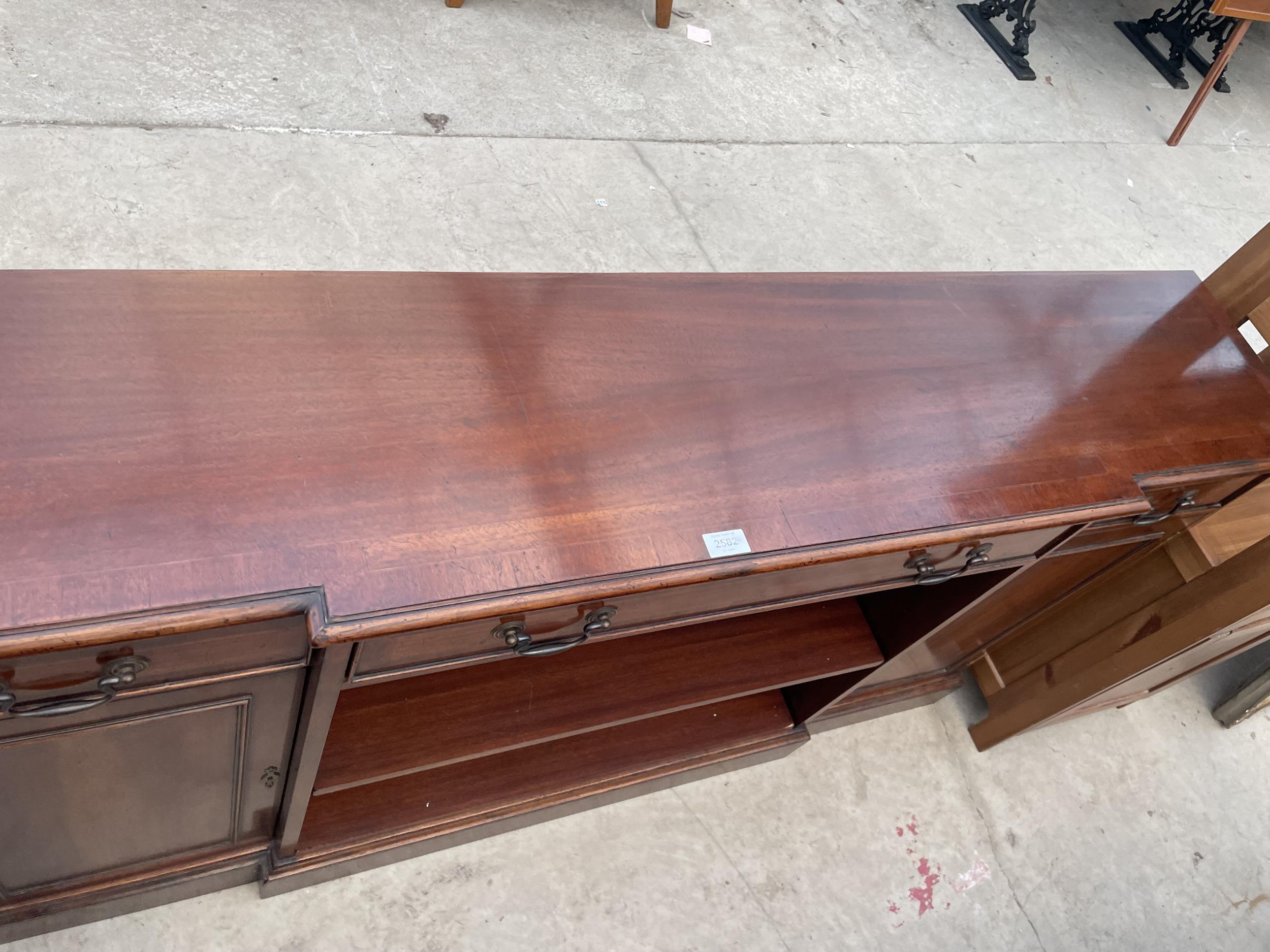 A REPRODUCTION MAHOGANY AND CROSSBANDED BREAKFRONT BOOKCASE WITH TWO CUPBOARDS AND THREE DRAWERS, - Image 2 of 4