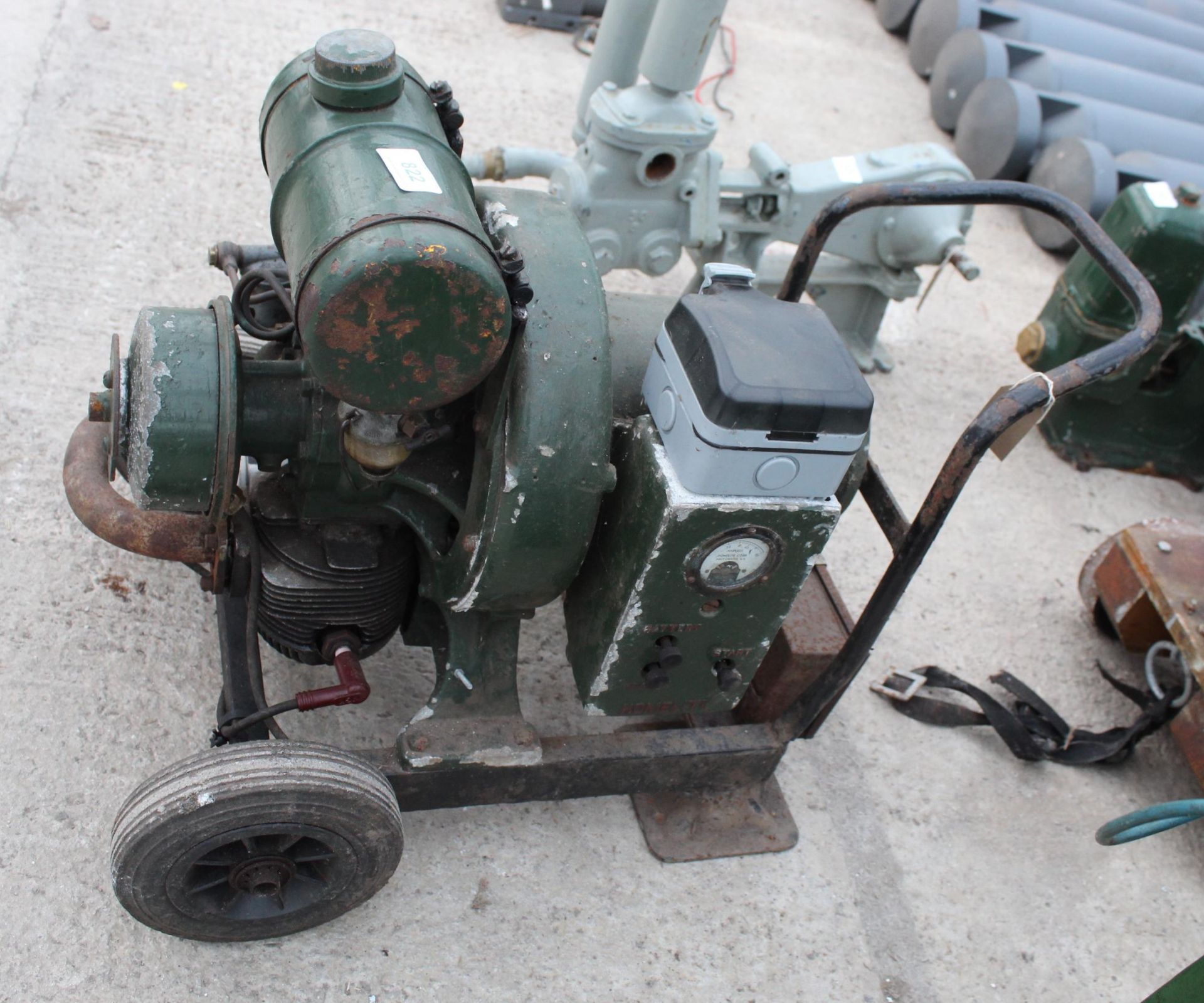 A VINTAGE HOMELITE PETROL GENERATOR ON A FOUR WHEELED TROLLEY BASE (MODERN ELECTRICAL ADDITIONS) - Image 2 of 3