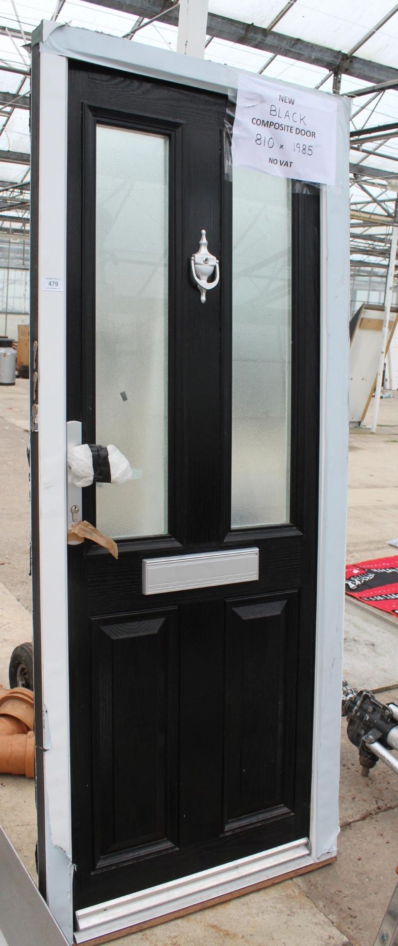 A NEW BLACK COMPOSITE DOOR AND FRAME 810MM X 1985MM LOCK AND KEYS IN LETTERBOX NO VAT