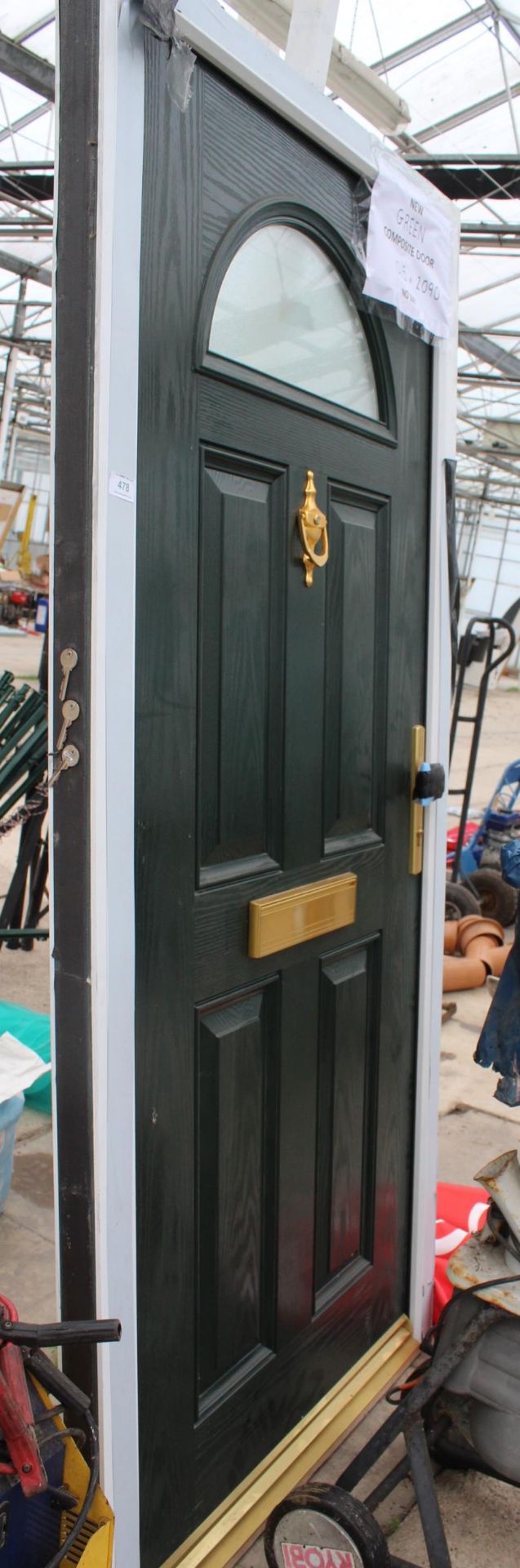 A NEW GREEN COMPOSITE DOOR AND FRAME 1015MM X 2090 MM LOCK AND KEYS IN LETTER BOX NO VAT