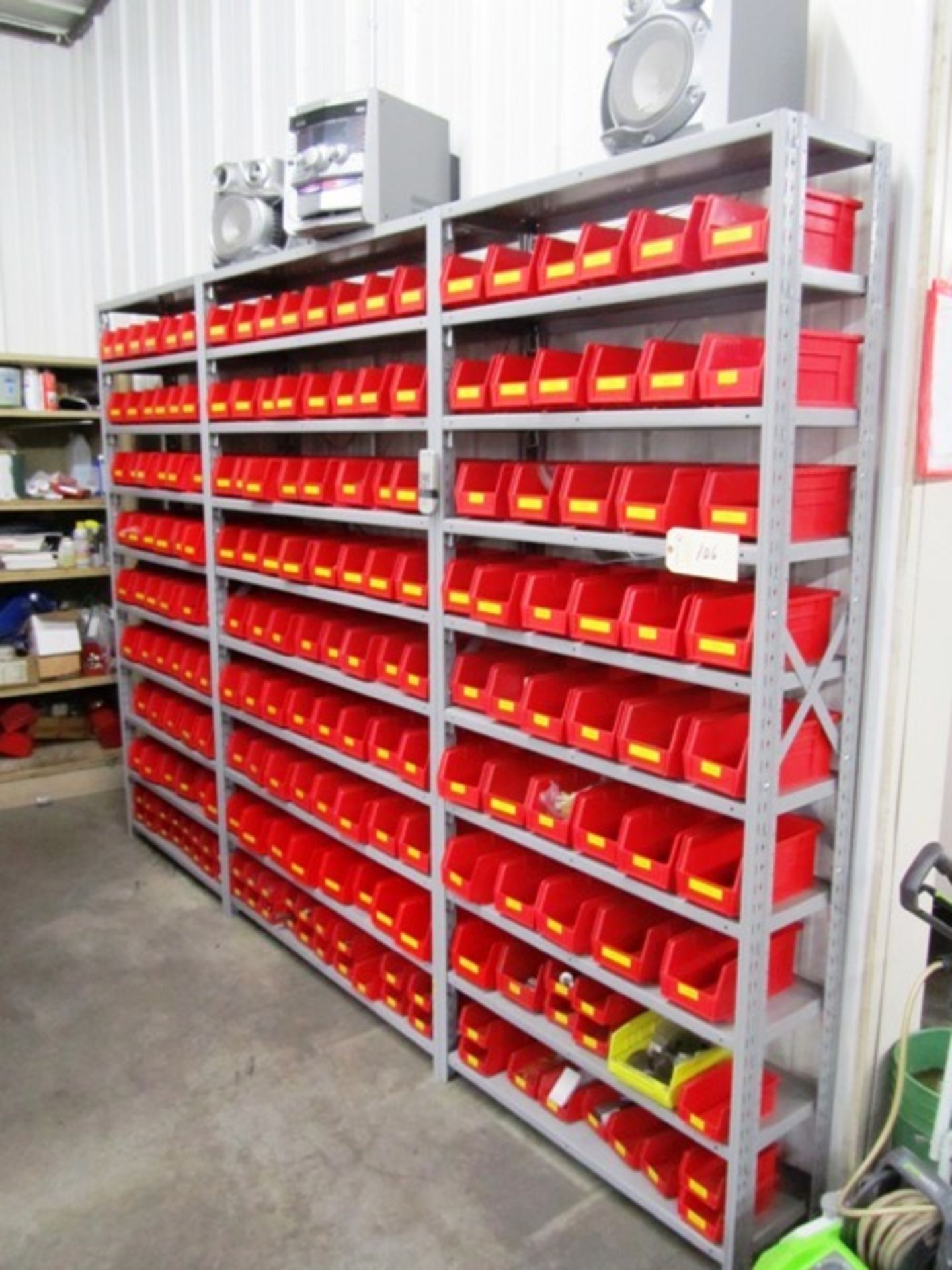3 Sections of Shelving with Red Parts Bins