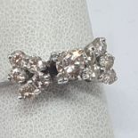 18 KT GOLD RING, 4.3 GRAMS WITH CENTRAL DIAMOND 0.40 CT AND LATERAL DIAMONDS COLOR CHAMPAGNE 0.70 CT