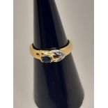 18 CARAT YELLOW GOLD RING WITH 3 LIGHT STITCH AND OVAL -CUT CENTRAL SAPPHIRE - MEASURES 12 - 3.1