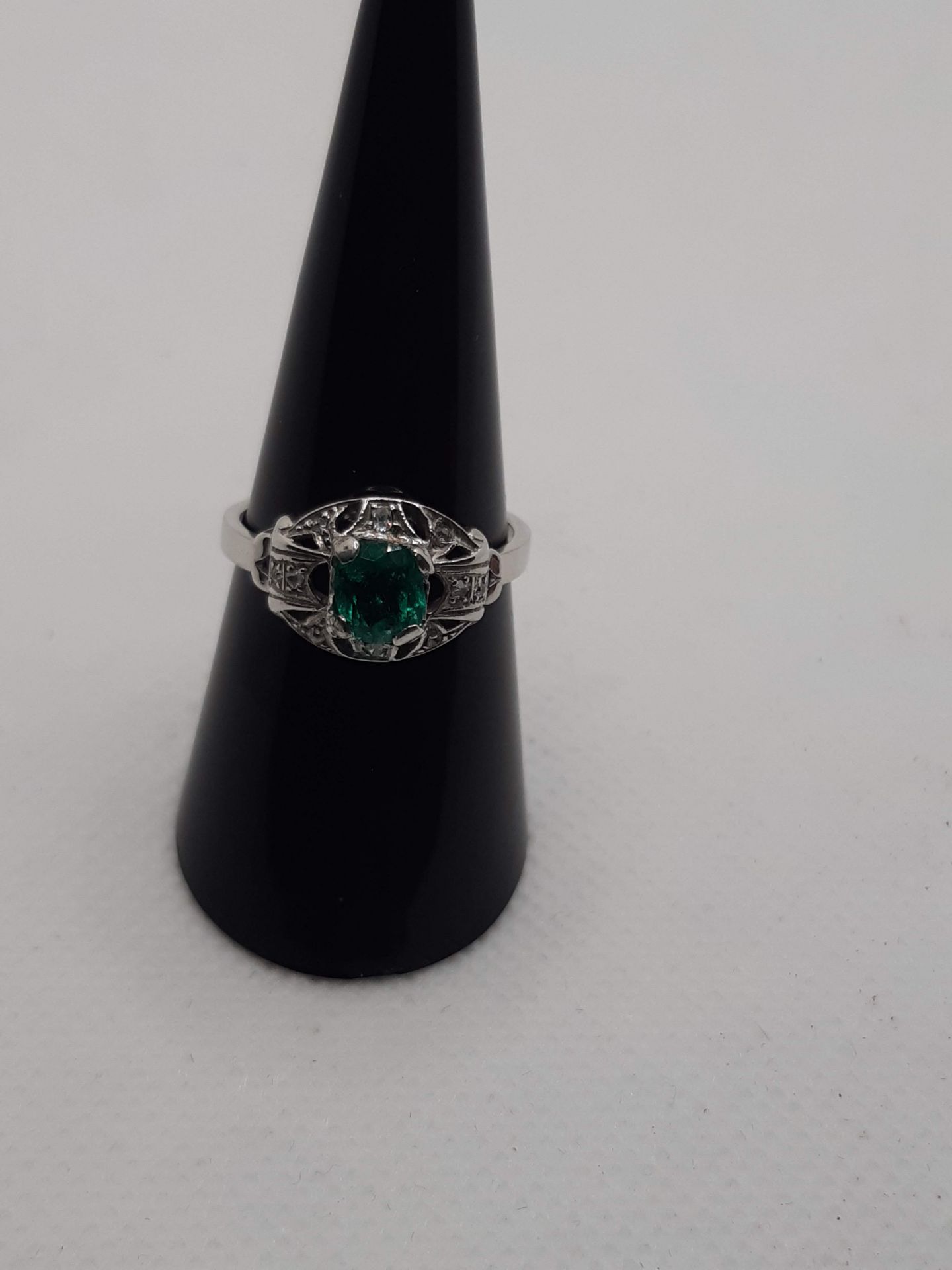 ANCIENT HANDMADE RING WITH DIAMOND ROSETTE IN OUTLINE OF AN OVAL GREEN EMERALD FROM 1.00 CT WEIGHT