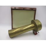 A vintage brass car horn along with a leather bound map holder