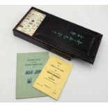 A vintage Mah-Jong set in wooden case