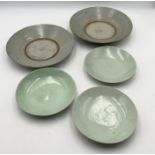 A collection of Oriental celadon pottery, three small dishes with marks to base - possibly Korean