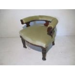 A Victorian mahogany tub chair on turned legs