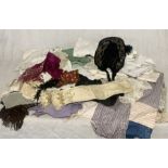 A collection of antique and other linen and clothing including hats, petticoats, table linen etc.