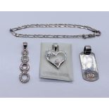 A small quantity of silver jewellery consisting of three pendants and a bracelet