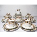 A Porcelain " Victoria" part tea set by C. Arkwright & Edwards, includes seven trios.