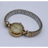 A 9ct gold ladies Tudor (Rolex) wristwatch with subsidiary second dial on expandable strap