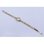 A 9ct gold Accurist ladies wrist watch (total weight 12.7g)