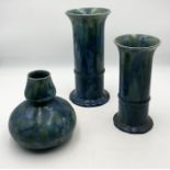 Three pieces of Candy Wescontree Ware including two cylindrical vases and a baluster vase