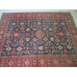 A good blue and red Persian style ground rug with stylised design - 312cm x 246cm