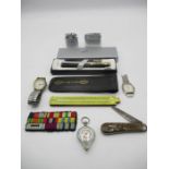 A collection of miscellaneous items including a Bulova watch, Taylor's Lambs foot penknife,