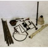 A collection of various vintage tools, stair rods, hopper etc