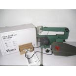 A boxed Ferm FFZ-400N scroll saw.