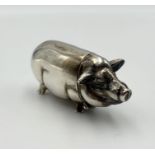 A silver vesta case in the form of a pig