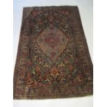 A blue ground Persian rug (A/F) 216cm x 141cm