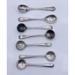 Four hallmarked silver salt spoons along with three silver plated spoons