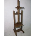 A Victorian adjustable oak artists easel. Makers plaque to reverse "Lechertier, Barbe &Co" Wooden