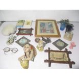 A collection of miscellaneous items including Italian wall decorations, a soapstone, religious items