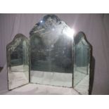 A vintage triptych mirror with etched glass