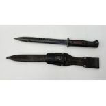 A WW2 German Bayonet and Frog 10 inch blade marked "S/155K" and Serial No. "8121". In its steel