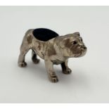 A silver pin cushion in the form of a bulldog