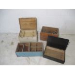 An assortment of wooden crates and boxes, one is marked "Ushers Trowbridge"