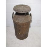 A rustic Hanwood Dairies Ltd milk churn with lid