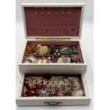 A collection of costume jewellery including brooches, filigree bracelet etc