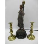 A spelter lamp after Rousseau "Faneuse" along with a pair of brass candlesticks