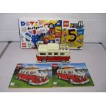 A completed Lego Creator 10220 Volkswagen T1 Camper Van with two instruction manuals, along with a