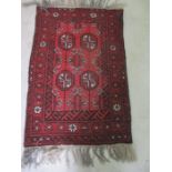 A Eastern red ground rug