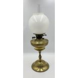 A turn of the century brass oil lamp