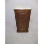 A Victorian pot cupboard with loose marble top