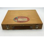 A vintage Winsor & Newton artists paint box with paints, accessories and pallet. Label for the