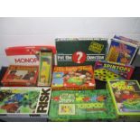 A collection of vintage boxed games including Crazy Maze, Pot The Question, Monopoly, Risk,