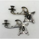 A pair of Art Nouveau silvered wall sconce candle holders