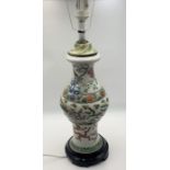 A Famille Verte Chinese vase which has been converted to a lamp