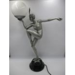 An Art Deco style lamp in the form of a female nude- repair to arm